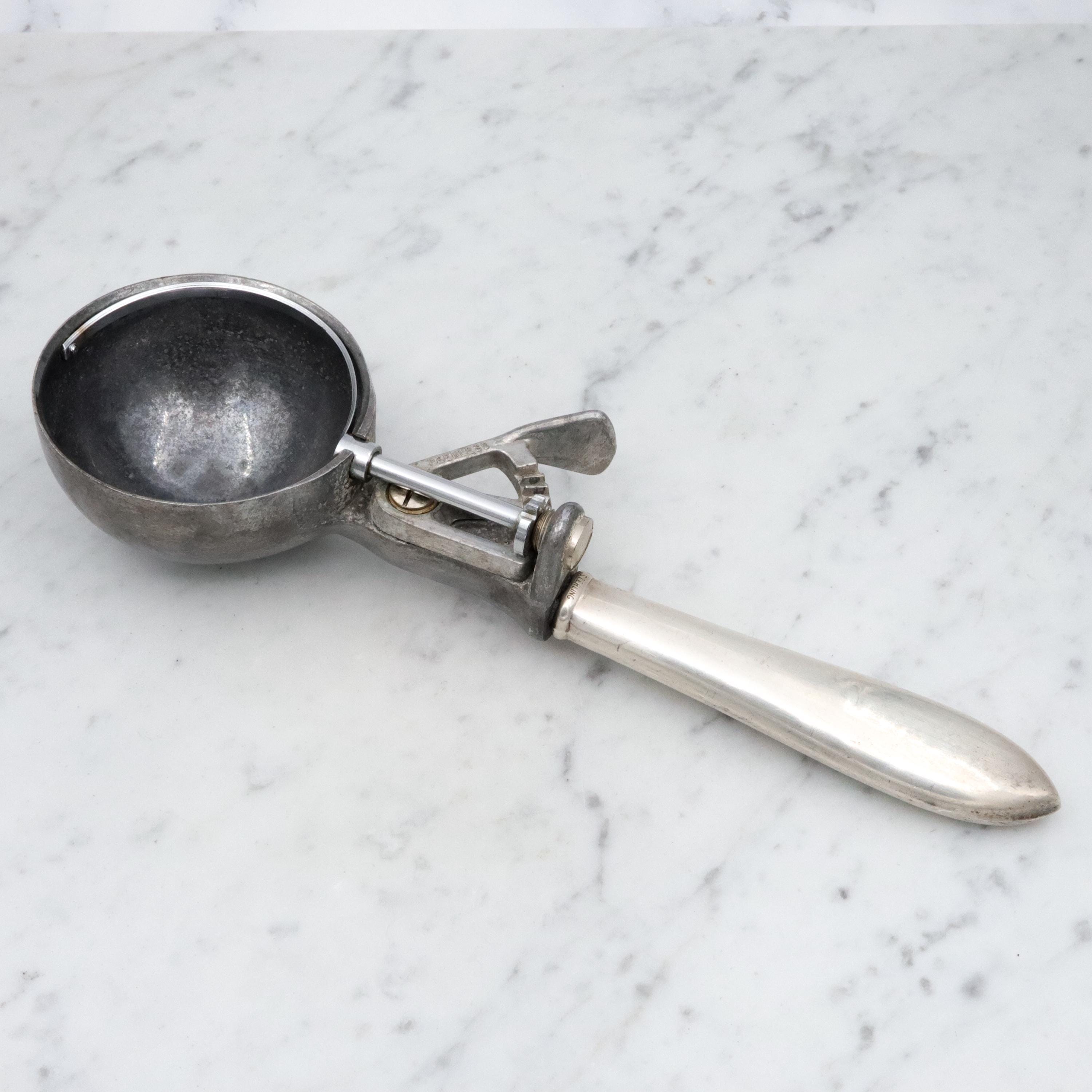 Retro Peerless aluminum spring loaded ice cream scoop with sterling handle
