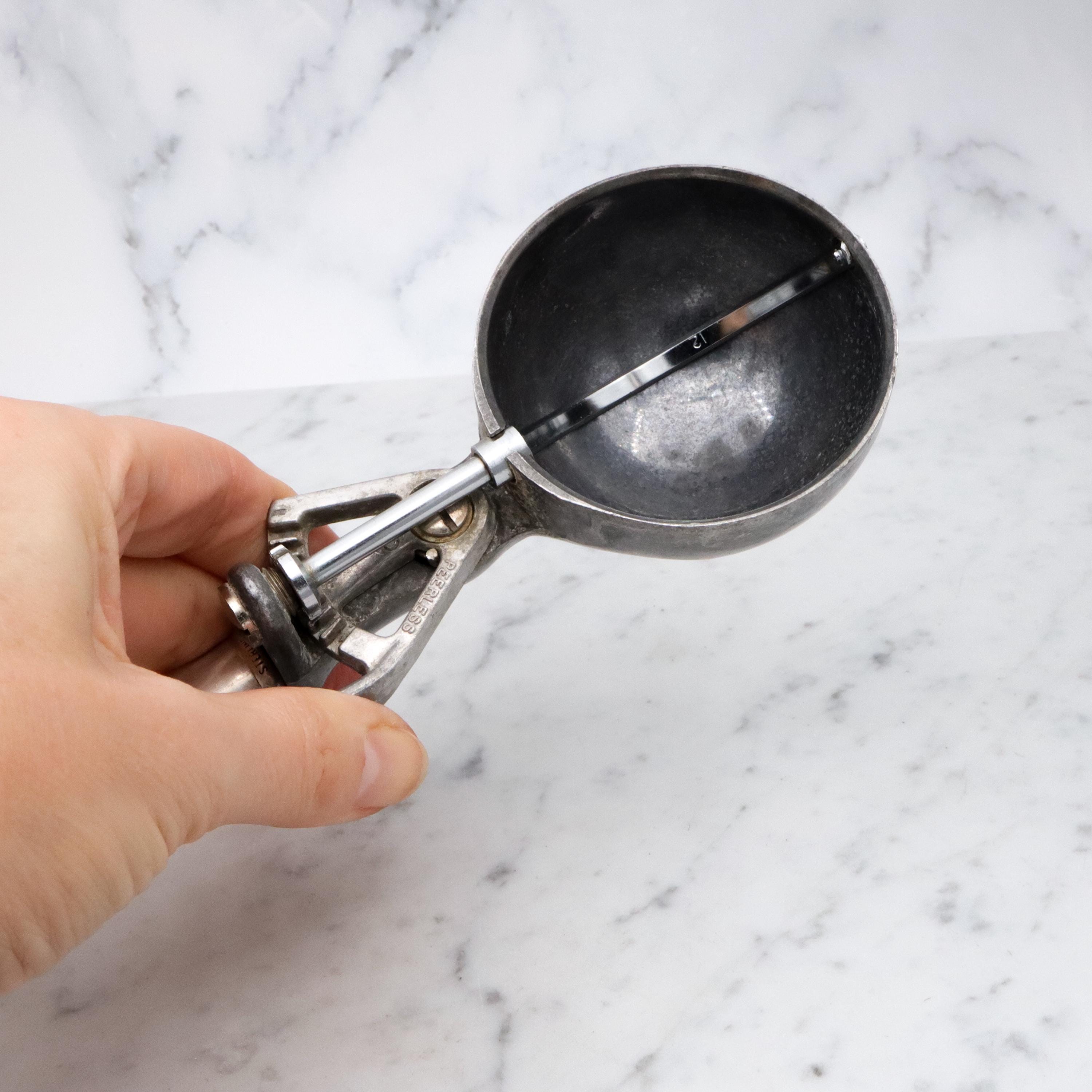 Retro Peerless aluminum spring loaded ice cream scoop with sterling handle