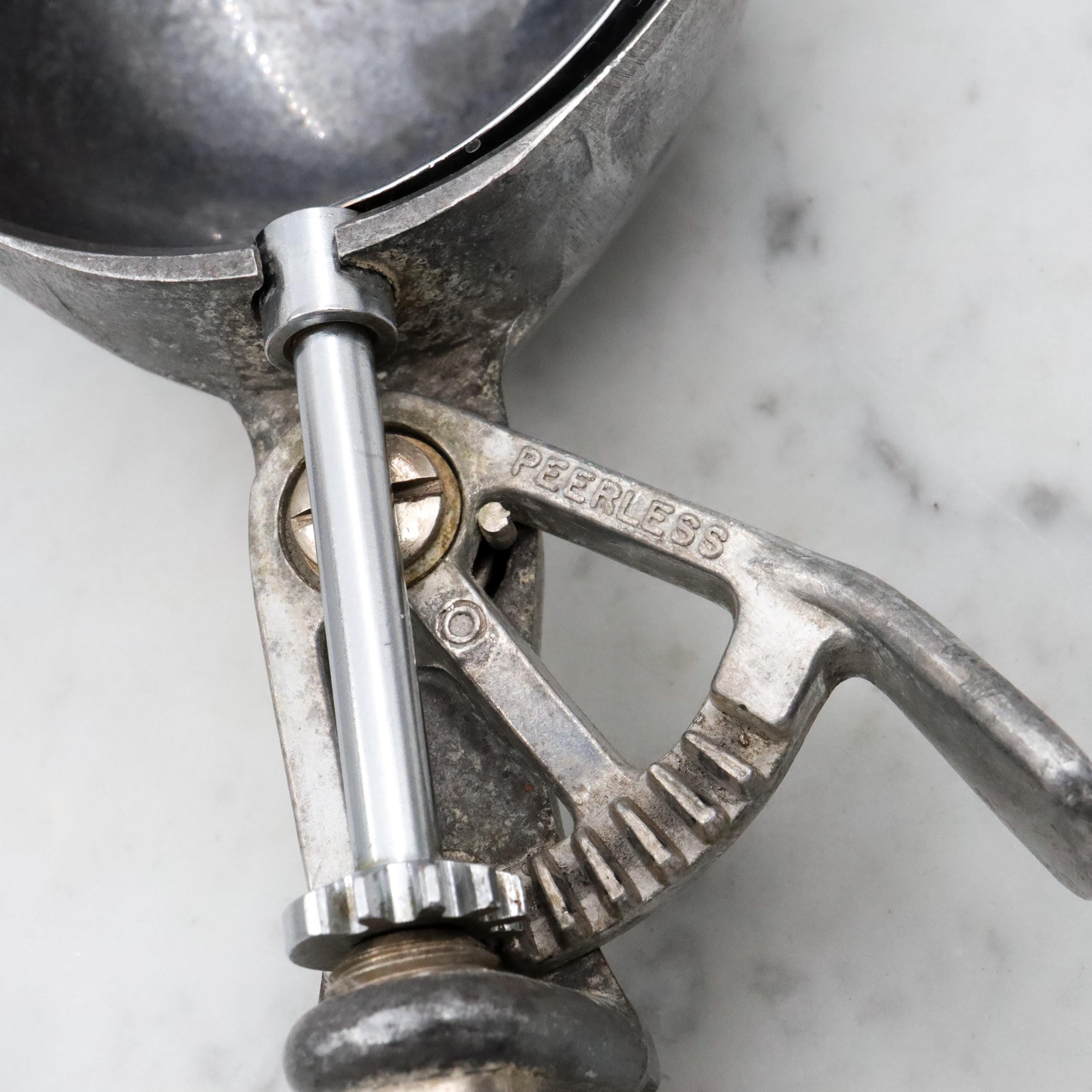 Retro Peerless aluminum spring loaded ice cream scoop with sterling handle