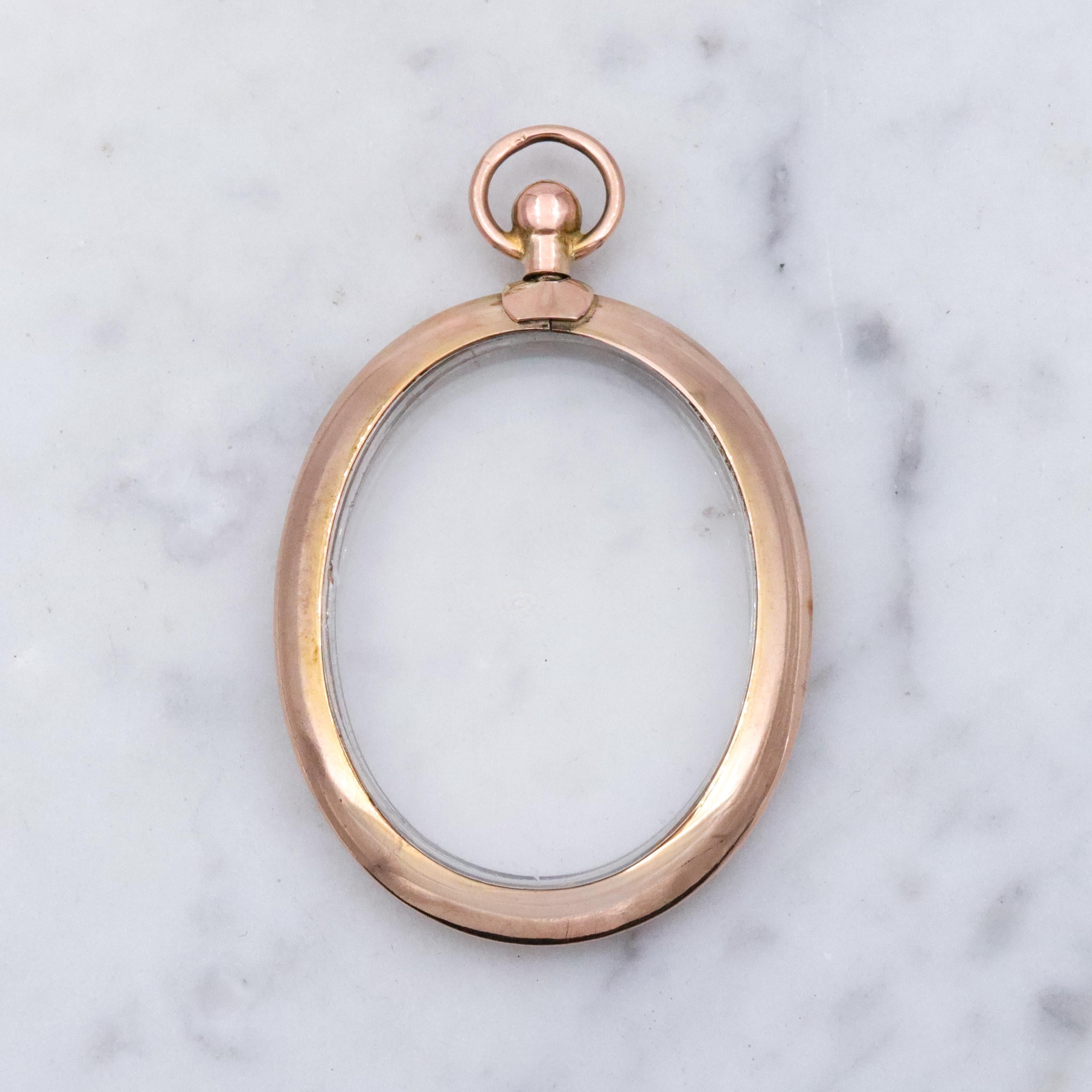 Edwardian 9K rose gold open-face glass locket pendant