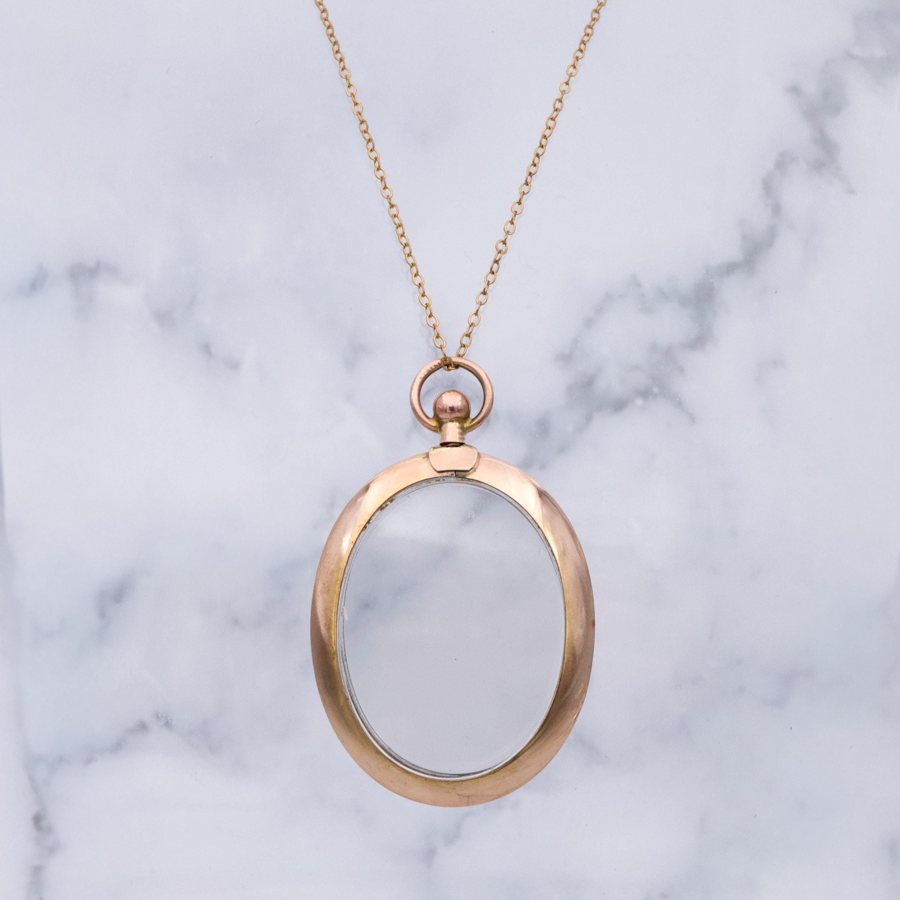 Edwardian 9K rose gold open-face glass locket pendant