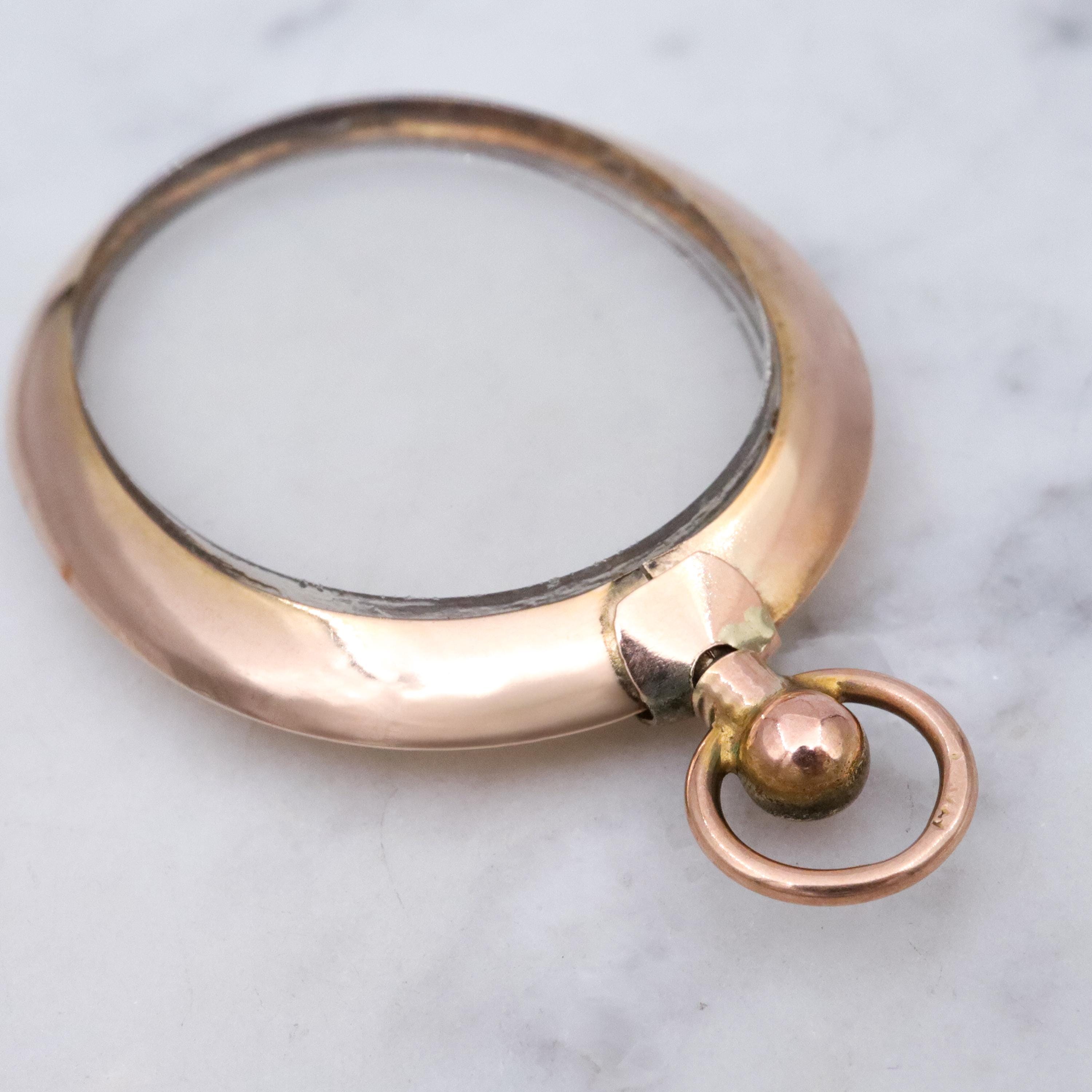 Edwardian 9K rose gold open-face glass locket pendant