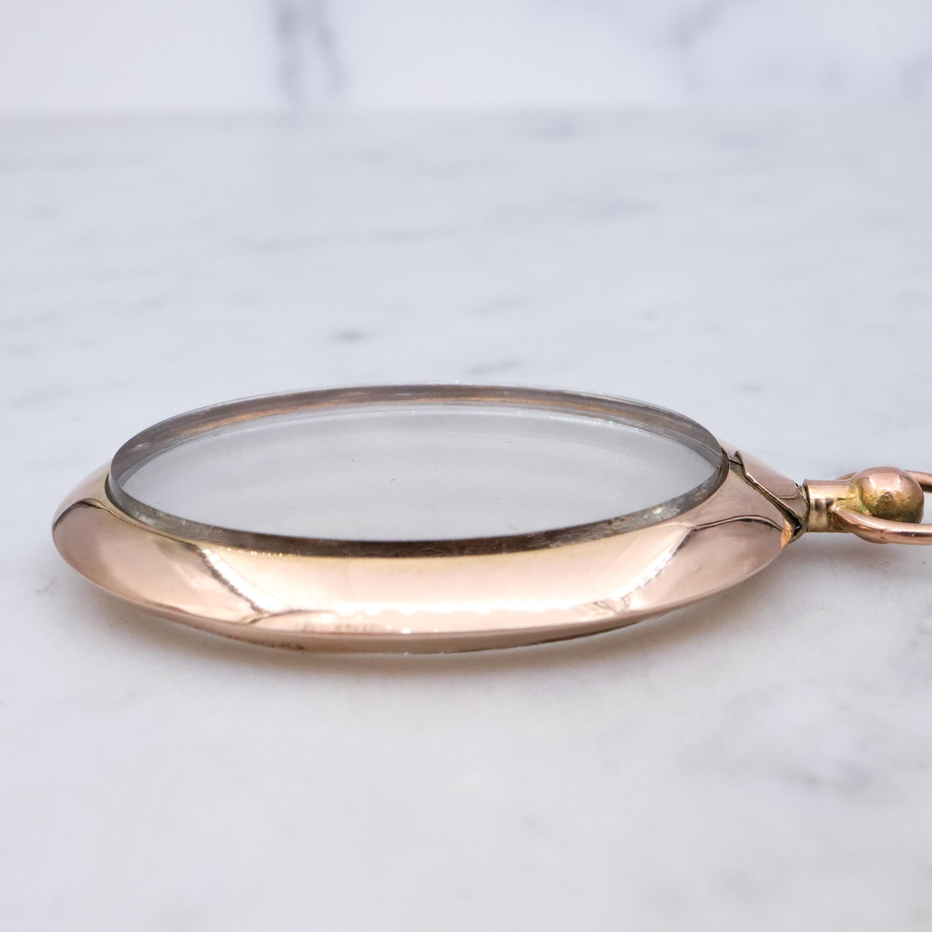 Edwardian 9K rose gold open-face glass locket pendant