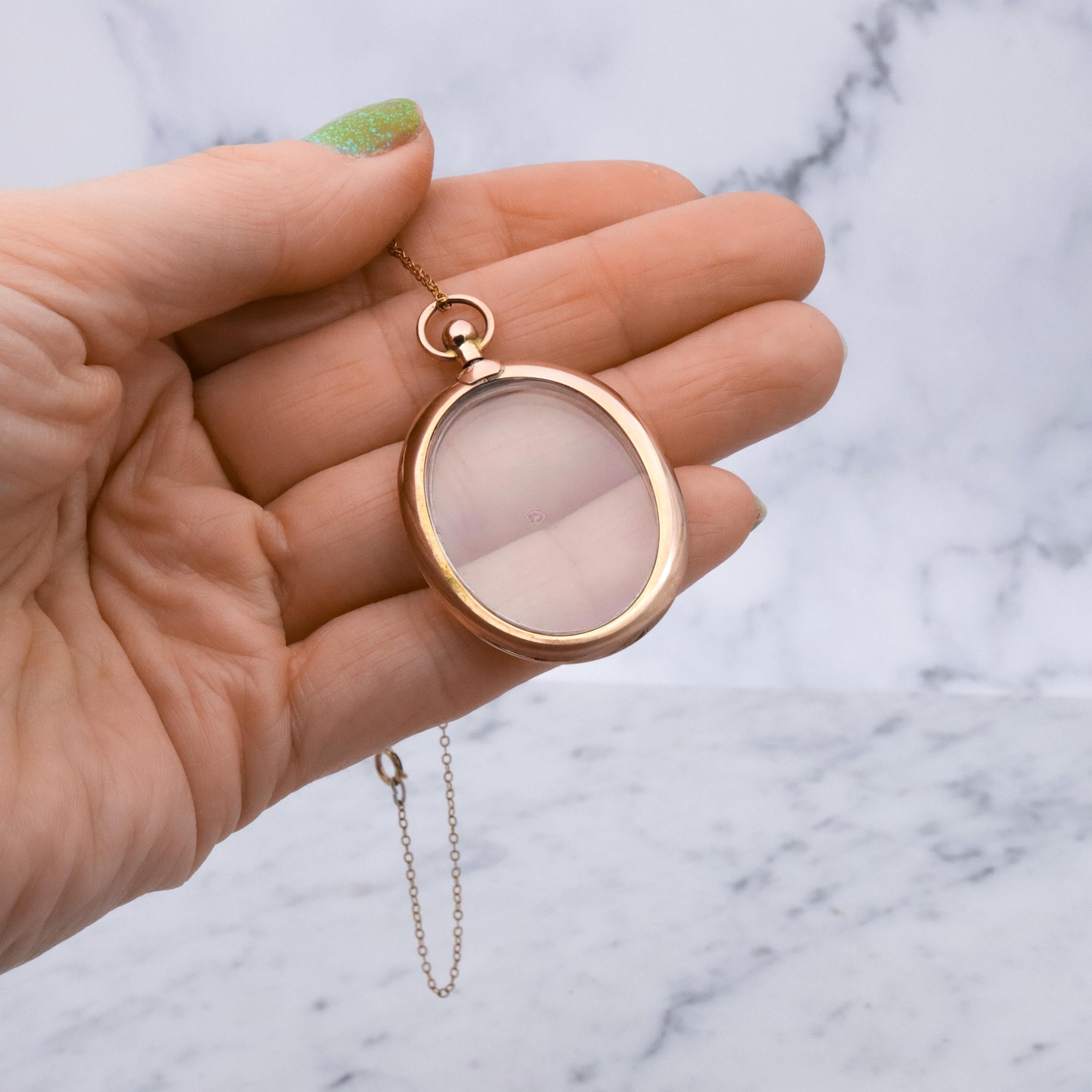 Edwardian 9K rose gold open-face glass locket pendant