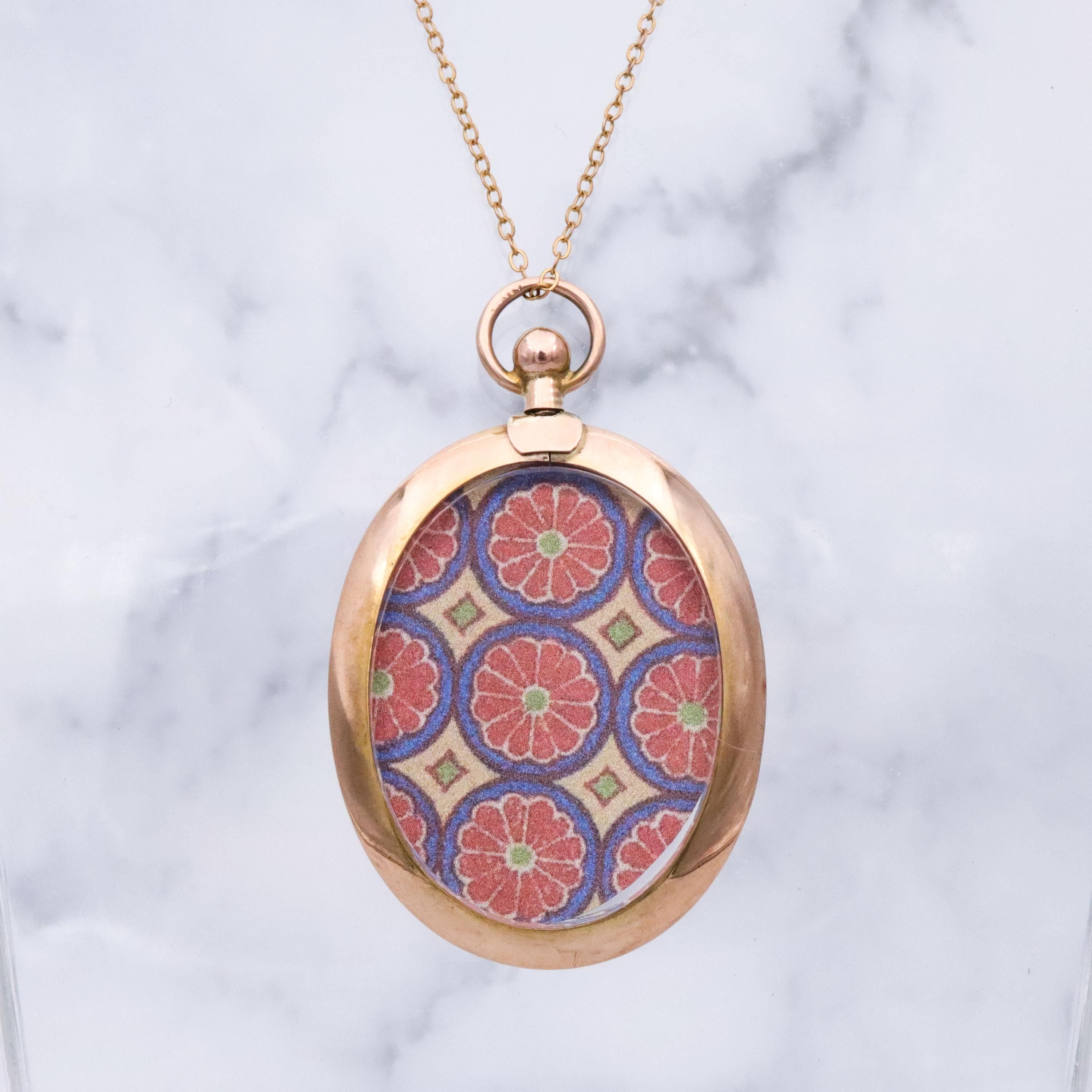 Edwardian 9K rose gold open-face glass locket pendant
