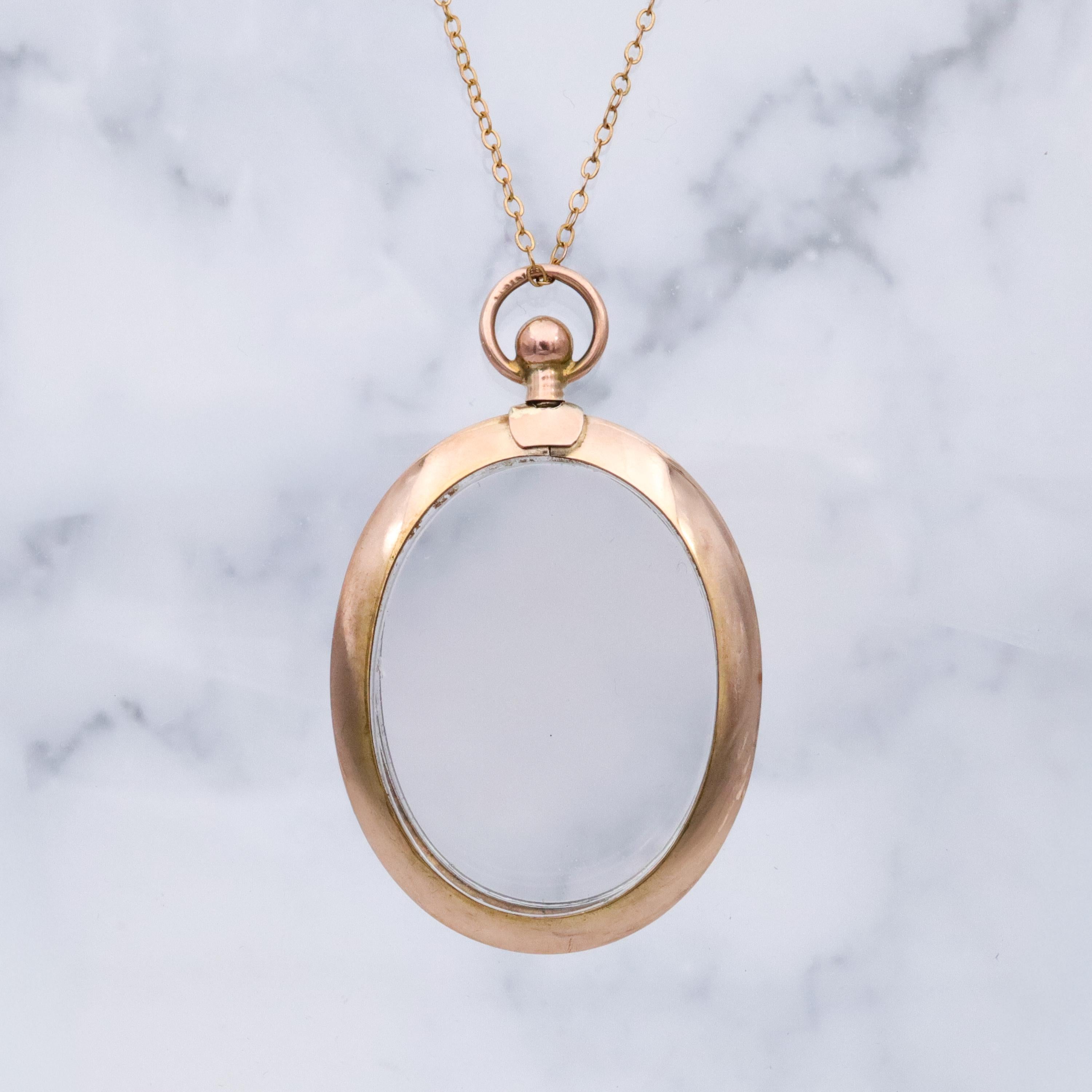 Edwardian 9K rose gold open-face glass locket pendant