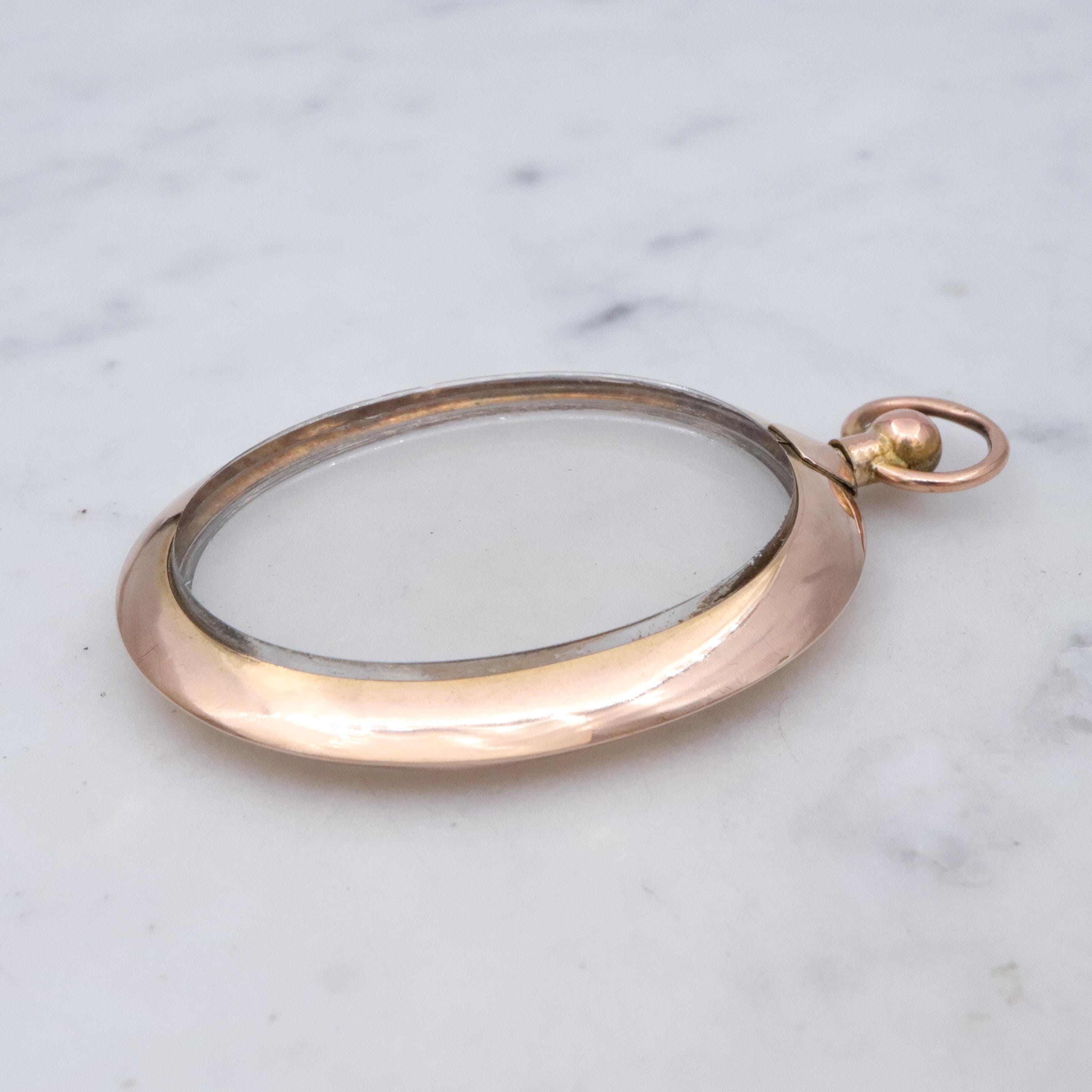 Edwardian 9K rose gold open-face glass locket pendant
