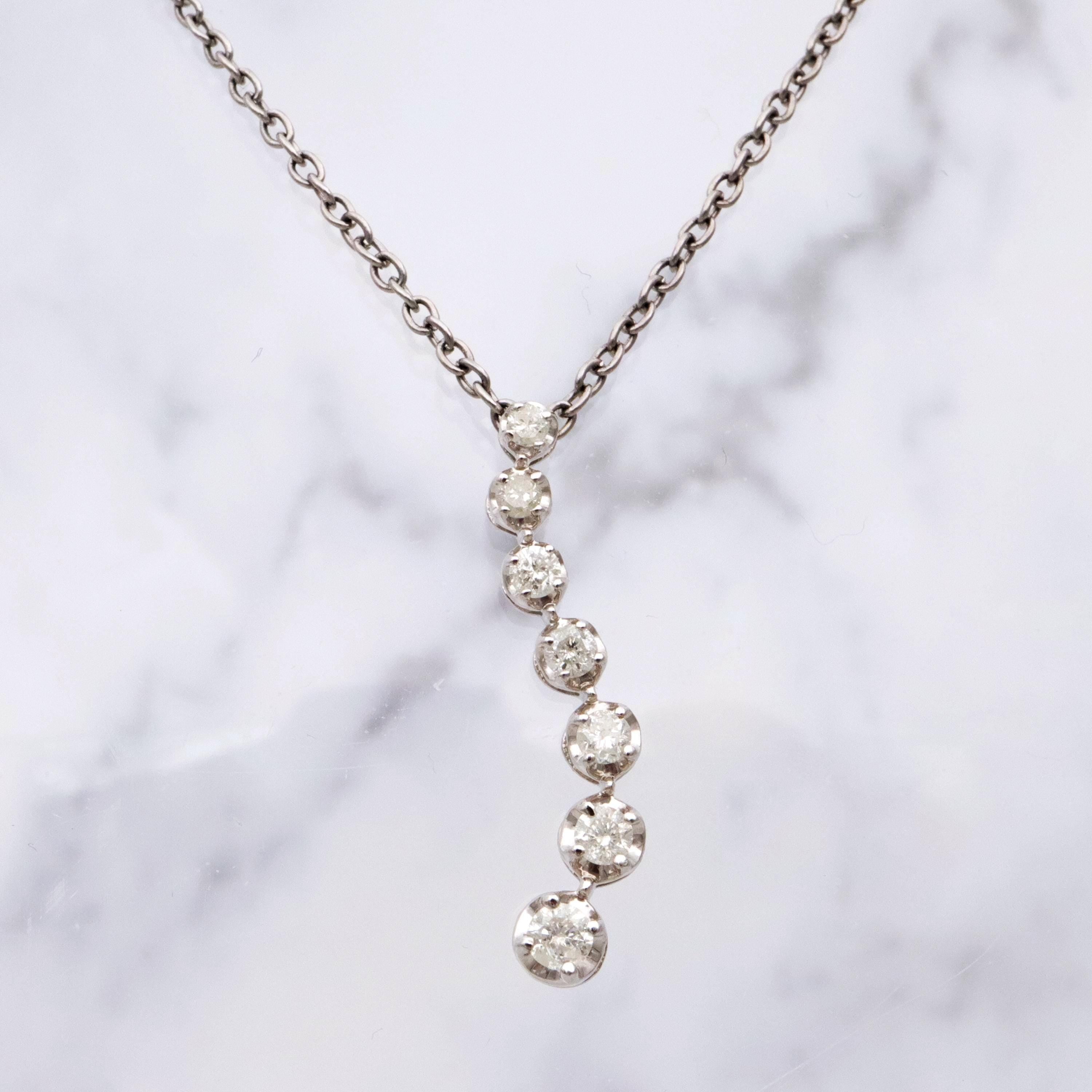 Vintage 10k white gold diamond graduated S-curve journey pendant