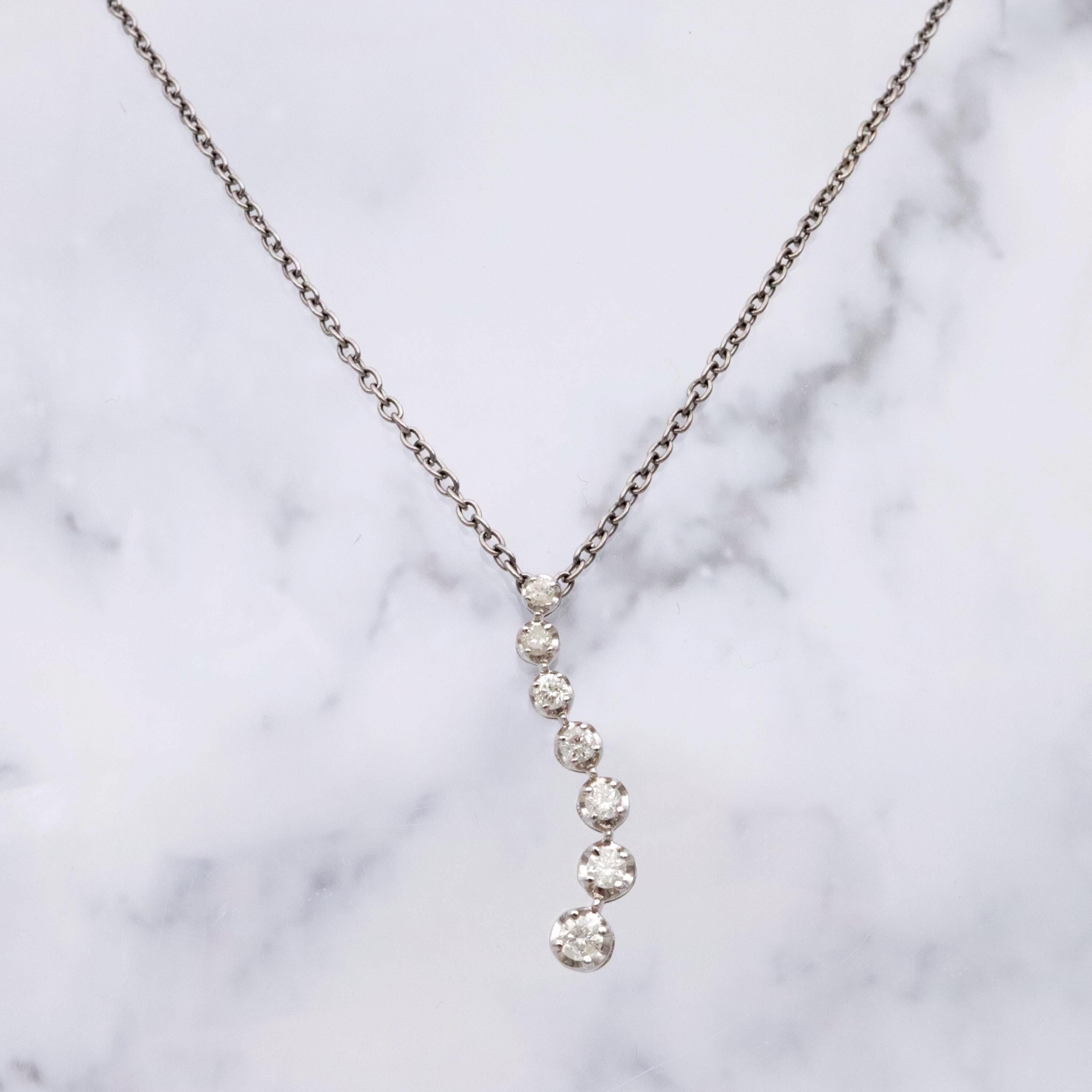 Vintage 10k white gold diamond graduated S-curve journey pendant
