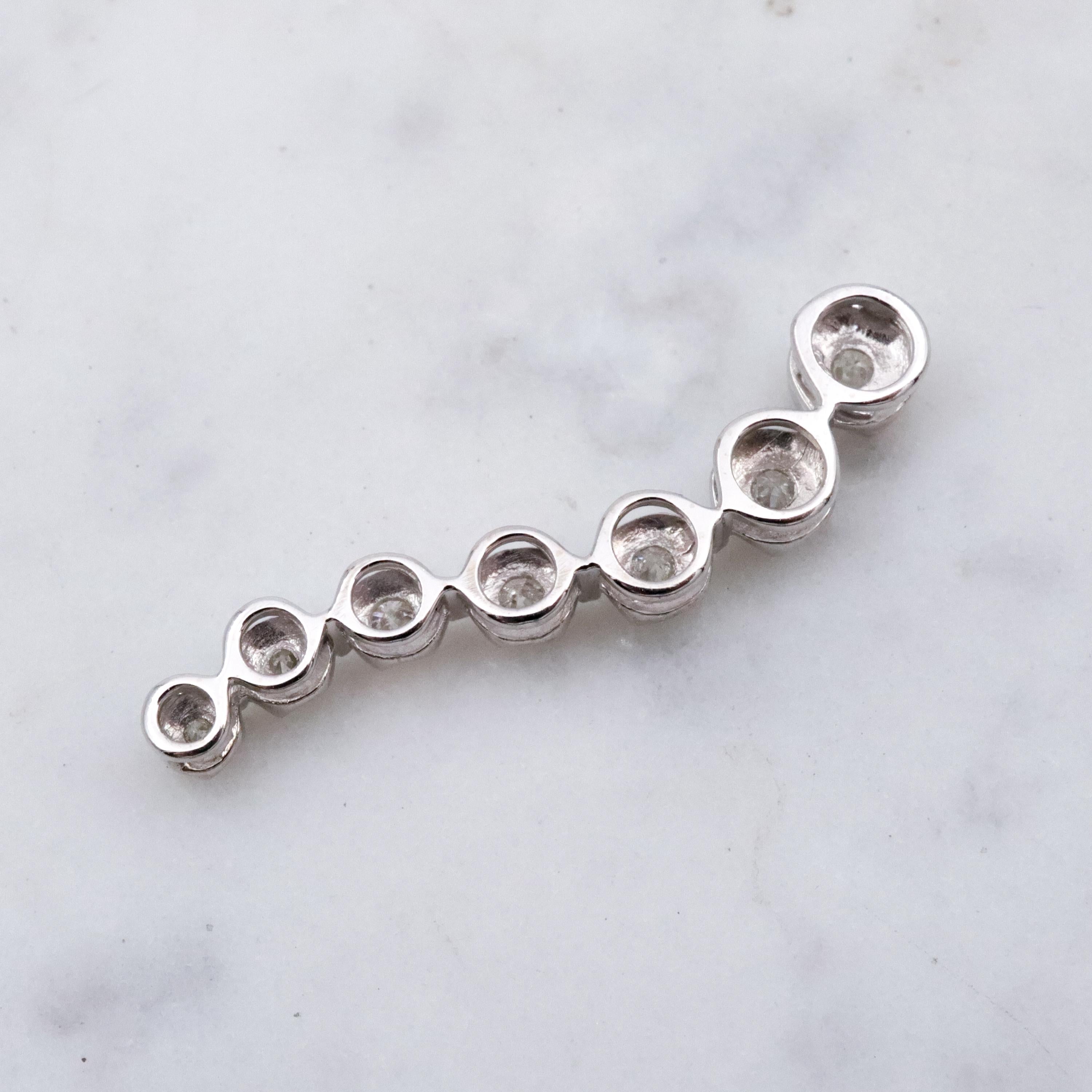 Vintage 10k white gold diamond graduated S-curve journey pendant