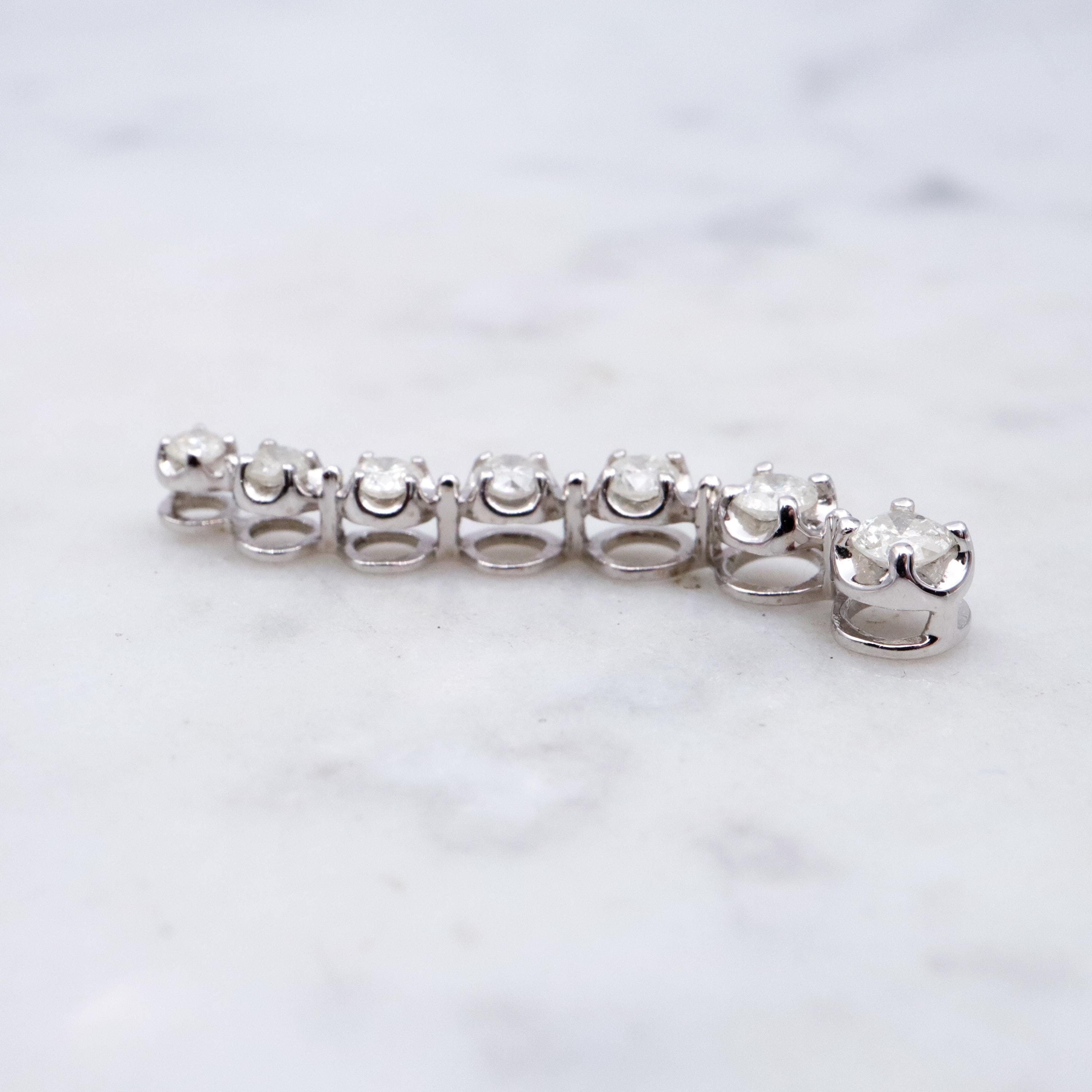 Vintage 10k white gold diamond graduated S-curve journey pendant