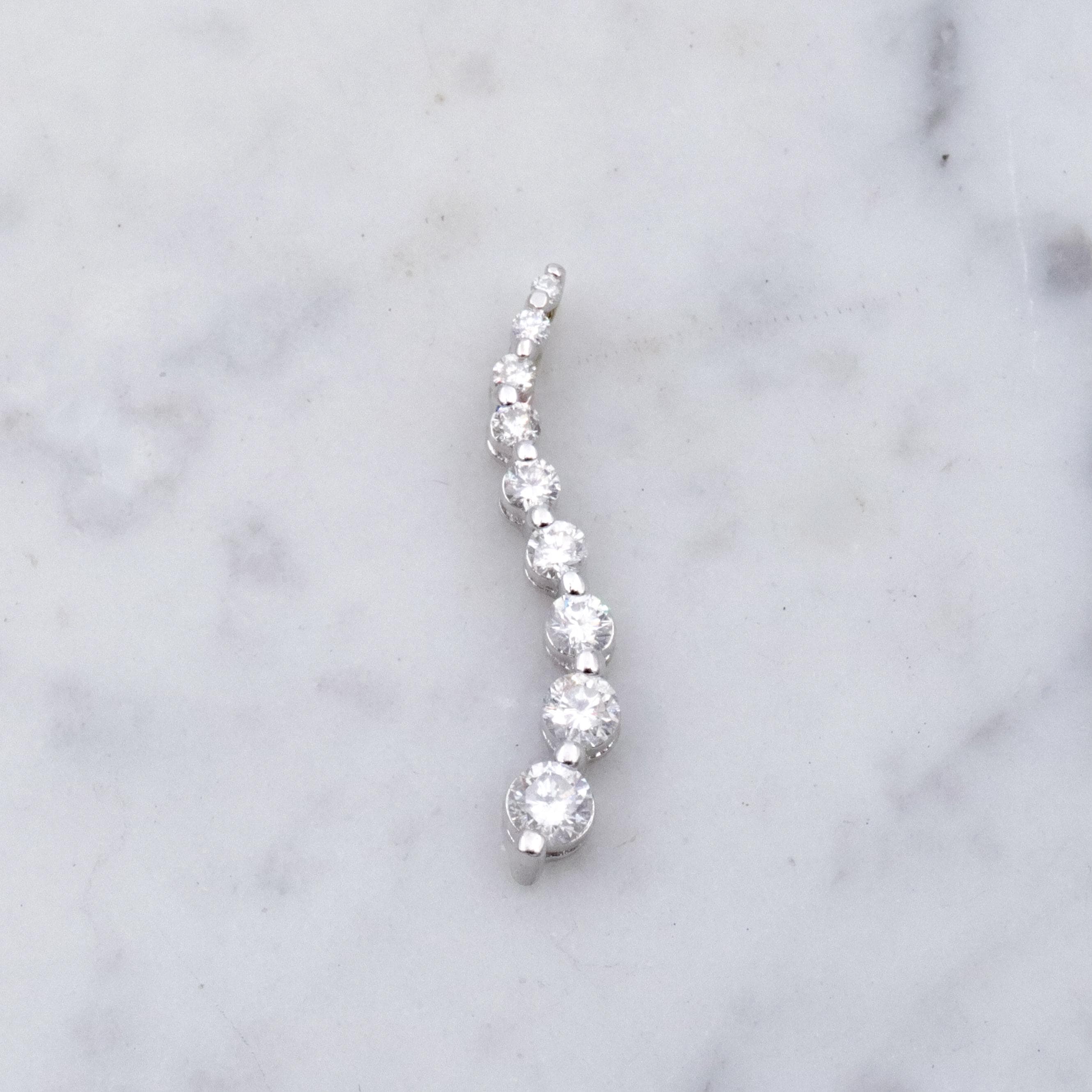 Vintage 14k white gold S-curve diamond journey pendant