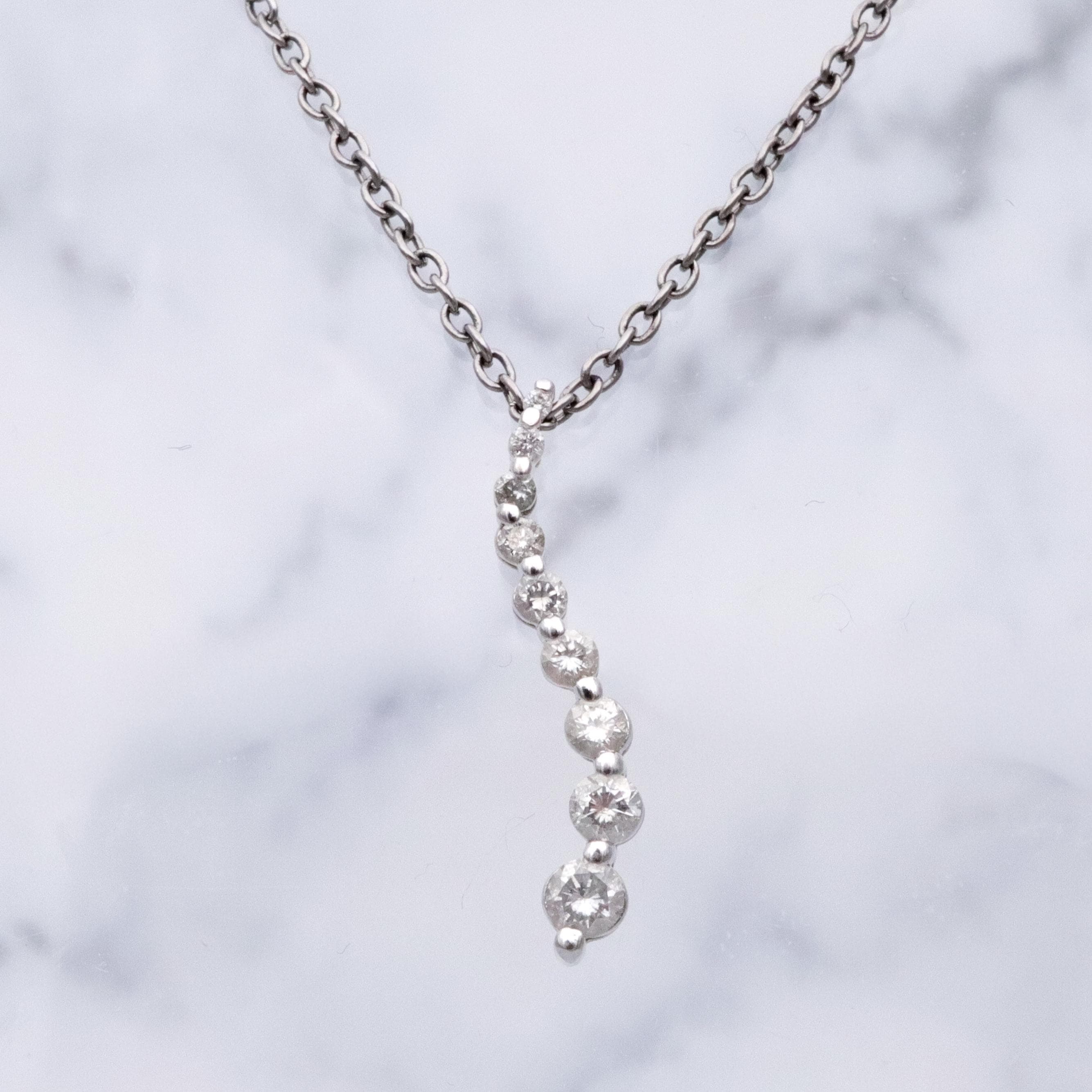 Vintage 14k white gold S-curve diamond journey pendant